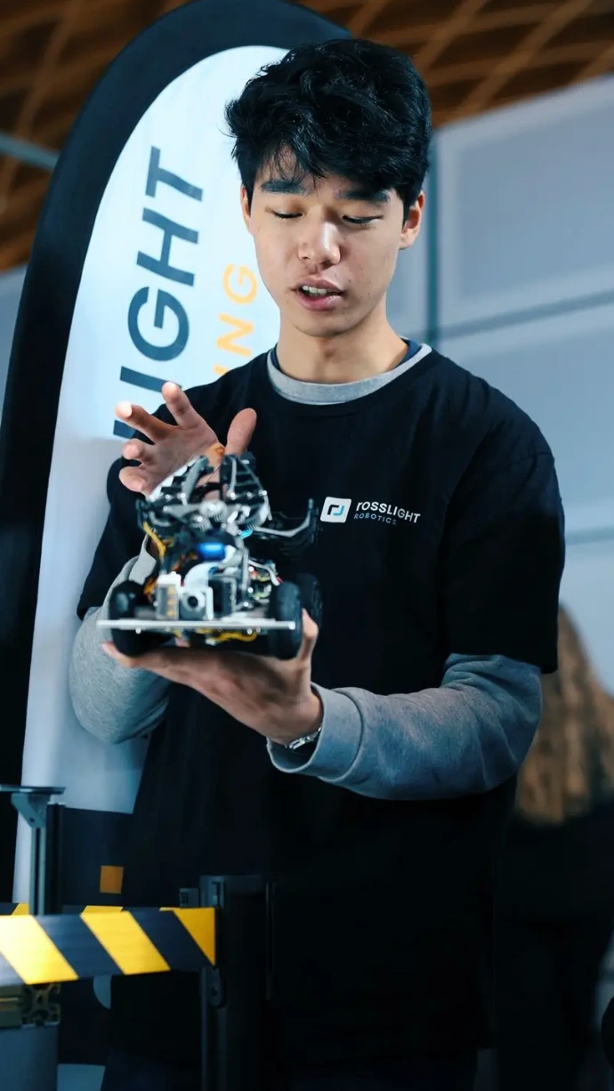 A men holding a robot